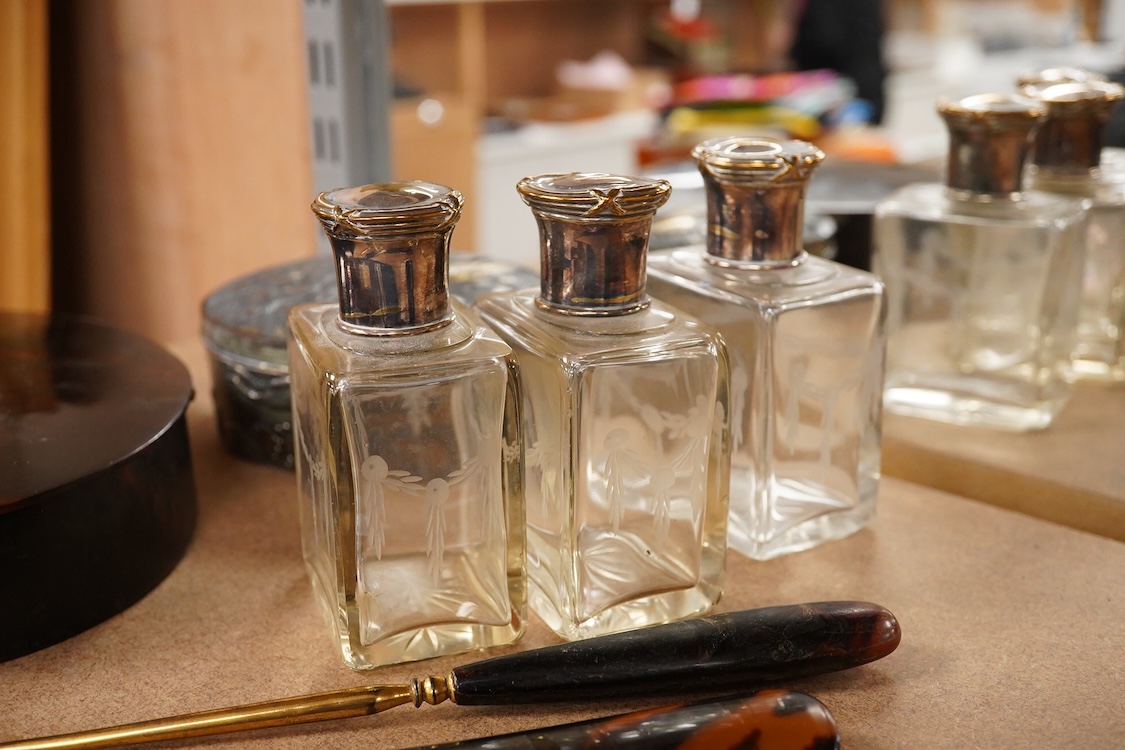 An Edwardian tortoiseshell jewellery box, a pair of gilt metal lorgnettes, a pair of half hoop gold earrings and pearl earrings, three jars etc